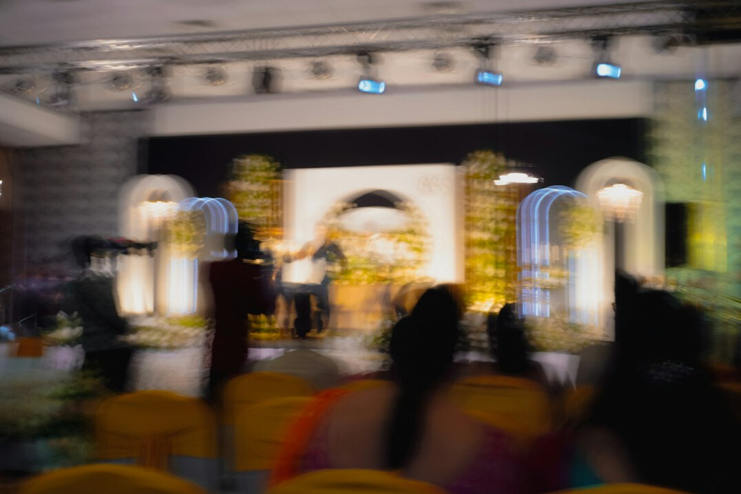 Business conference with speaker and audience